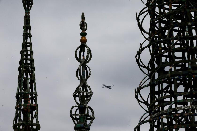 Long Beach, CA - Gray clouds hang over the historic Watts Towers as May Gray gives way to June Gloom in Southern California this week. June 05: in Long Beach on Monday, June 5, 2023 in Long Beach, CA. (Luis Sinco / Los Angeles Times)
