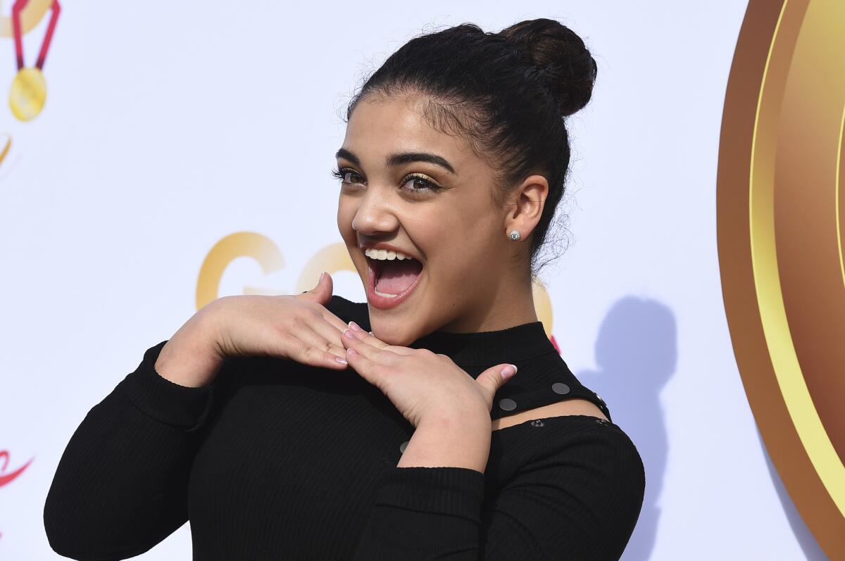 Laurie Hernandez arrives at Saturday's Gold Meets Golden event.