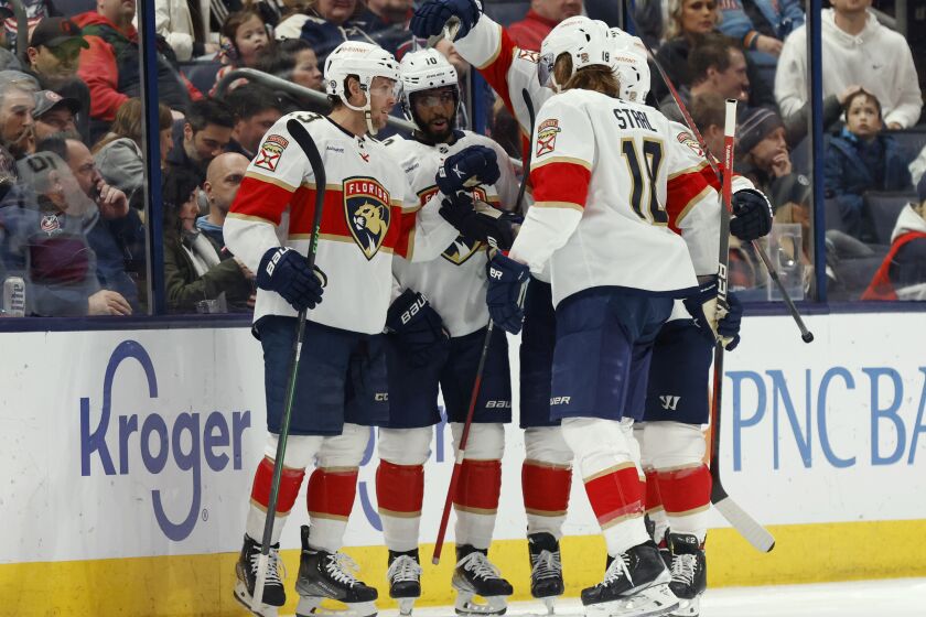 Florida Panthers forward Carter Verhaeghe (23) celebrates his third goal of the night against the Columbus Blue Jackets with forward Anthony Duclair (10), forward Aleksander Barkov (16), defenseman Brandon Montour and defenseman Marc Staal (18) during the second period of an NHL hockey game in Columbus, Ohio, Saturday, April 1, 2023. (AP Photo/Paul Vernon)