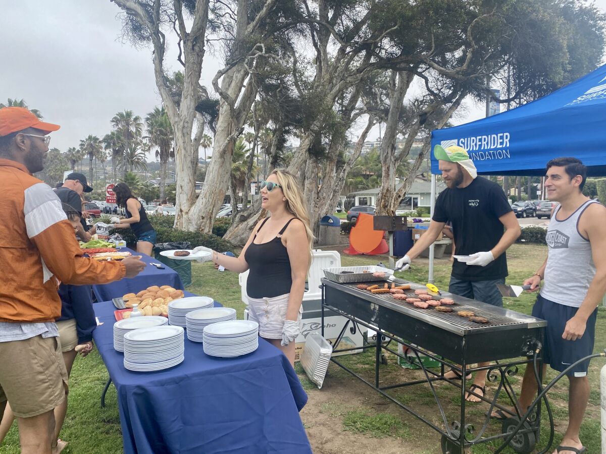 Surfrider Foundation San Diego County serves vegetarian fare on reusable plates as part of its zero-waste barbecue.