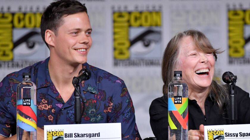 Bill Skarsgard and Sissy Spacek speak onstage at Hulu's panel for "Castle Rock" during Comic-Con International 2018.