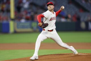 Los Angeles Angels starting pitcher Reid Detmers throws during the first inning.