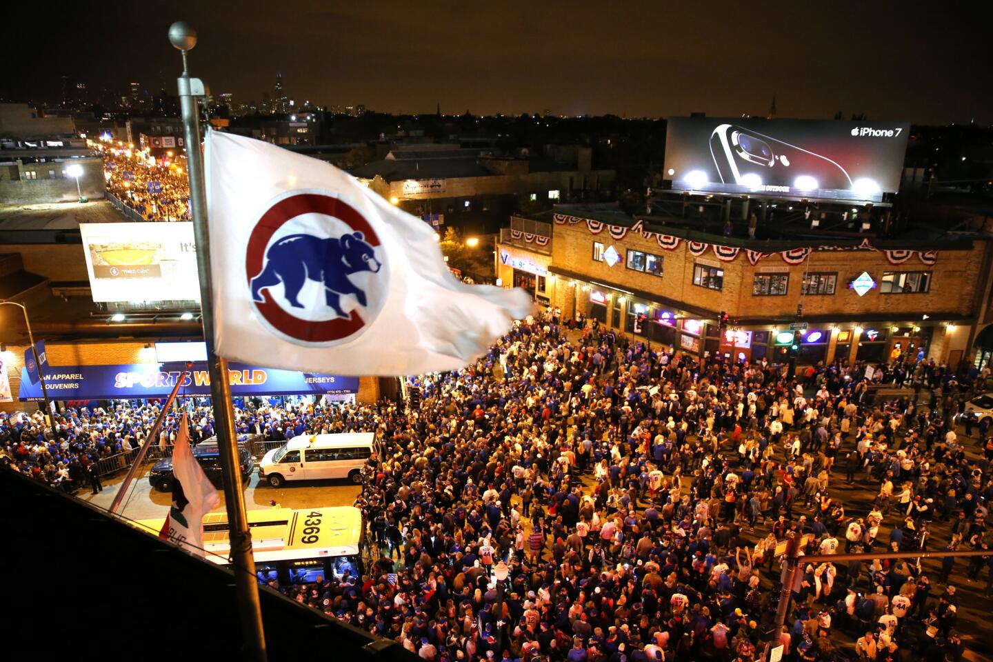 Fans crowd the intersection of Addison and Clark after the Cubs' 8-4 win over the Dodgers.