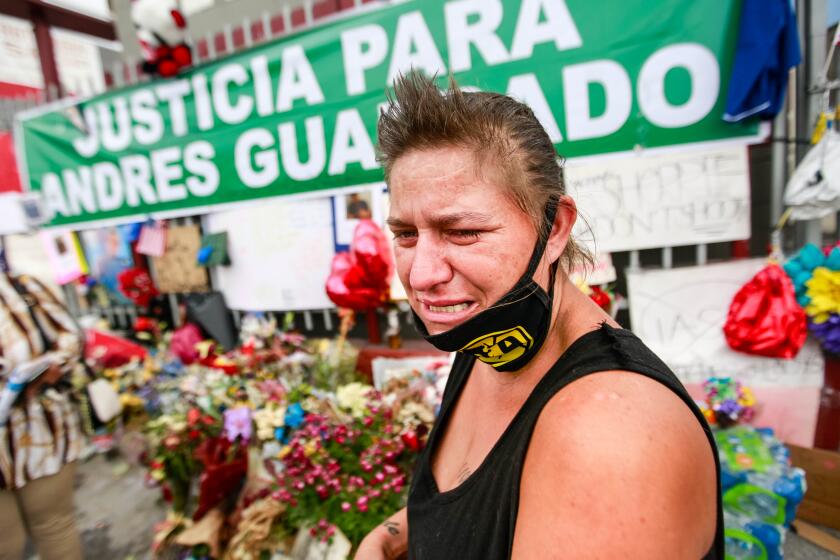 GARDENA, CA - JUNE 28: George Laird cries as she recounts how Andres Guardado, who was fatally shot by a sheriff's deputy in Gardena, near where she lives in hear RV on Sunday, June 28, 2020 in Gardena, CA. Laird is still emotional from being in the area and viewing the events of the killing. (Jason Armond / Los Angeles Times)