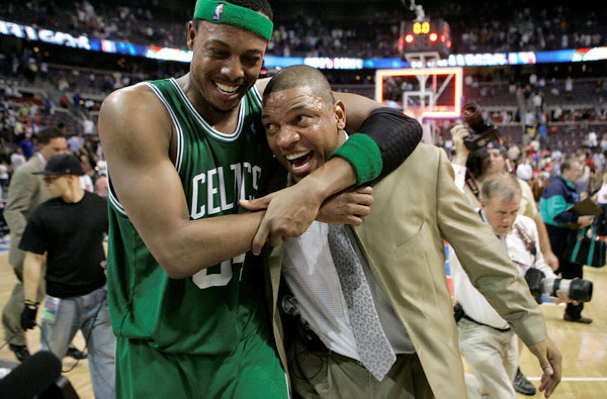 Forward Paul Pierce hugs Coach Doc Rivers after the Celtics defeated the Detroit Pistons in Game 6 to win the NBA Eastern Conference finals in 2008. Pierce is now with the Nets, who will play the Rivers-led Clippers on Saturday night.