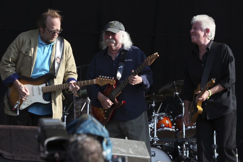 FILE - In this June 27, 2010 file photo, Stephen Stills, from left, David Crosby and Graham Nash, from the band Crosby, Stills and Nash perform in Hyde Park, London. The band surprised the audience when they walked onstage uncharacteristically dressed in formal dark gray Brooks Brothers suits for a benefit concert with Wynton Marsalis' Jazz at Lincoln Center Orchestra, Saturday, May 4, 2013, in New York. (AP Photo/Andy Paradise, file) EDITORIAL USE ONLY.