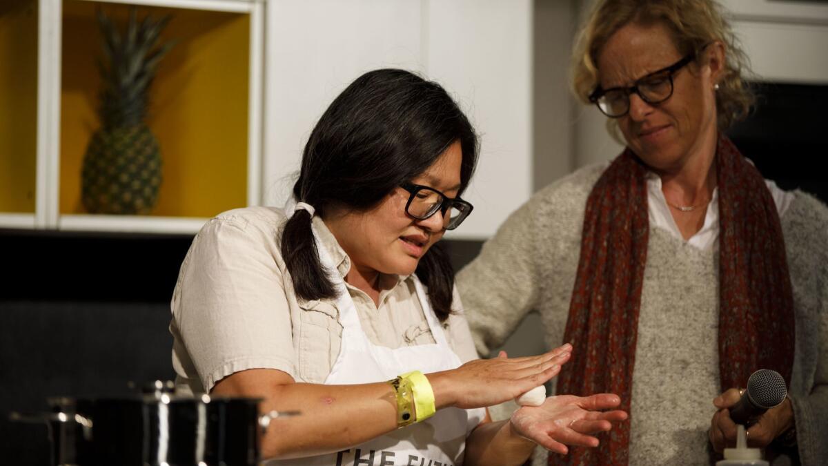 Minh Phan of Porridge + Puffs prepares savory fig mochi with the L.A. Times' Amy Scattergood on the Culinary Stage during The Taste on the Paramount Studios backlot .
