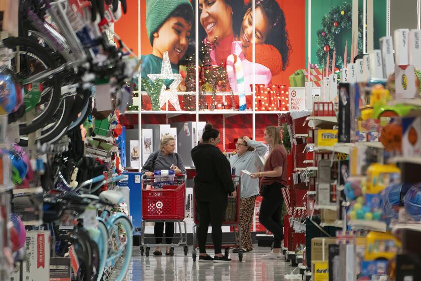 San Diego, CA - November 24: On Friday, Nov. 24, 2023, at the Target store in Clairemont, shoppers look over Christmas decorating holiday items during Black Friday. (Nelvin C. Cepeda / The San Diego Union-Tribune)