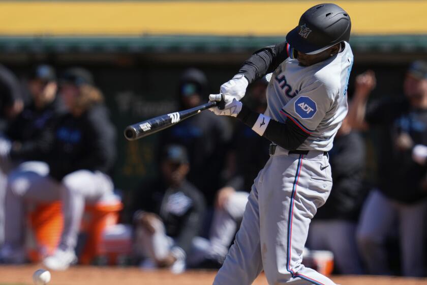 Miami Marlins' Nick Gordon hits a single against the Oakland Athletics during the ninth inning of a baseball game, Sunday, May 5, 2024, in Oakland, Calif. (AP Photo/Godofredo A. Vásquez)
