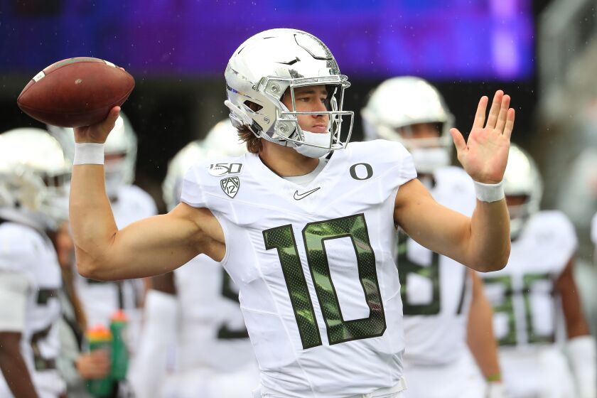 SEATTLE, WASHINGTON - OCTOBER 19: Justin Herbert #10 of the Oregon Ducks warms up prior to taking on the Washington Huskies during their game at Husky Stadium on October 19, 2019 in Seattle, Washington. (Photo by Abbie Parr/Getty Images) ** OUTS - ELSENT, FPG, CM - OUTS * NM, PH, VA if sourced by CT, LA or MoD **