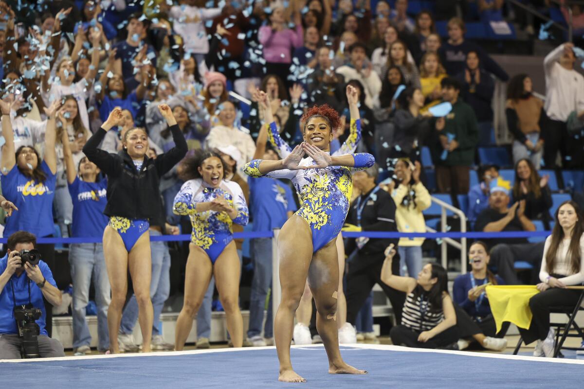 Confetti flies at the conclusion of Nya Reed's floor routine at Pauley Pavilion.