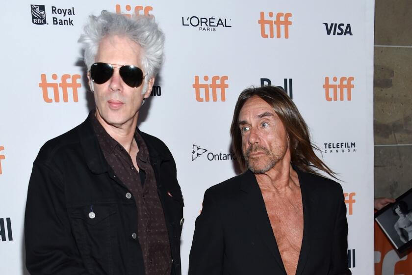 Director Jim Jarmusch, left, and singer Iggy Pop attend the "Gimme Danger" premiere at the Toronto International Film Festival on Sept. 14.