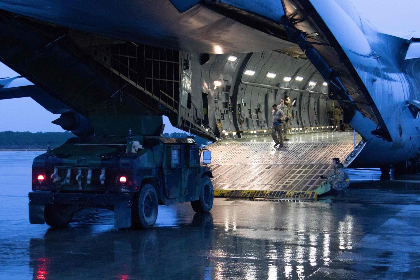 Equipment assigned to 1st Brigade Combat Team, 82nd Airborne Division is loaded into aircraft from Ft. Bragg, N.C.