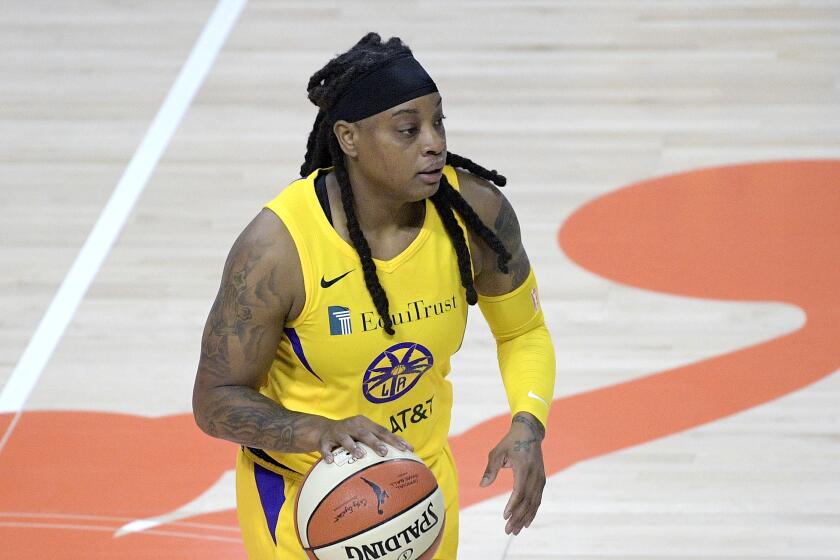 Los Angeles Sparks guard Riquna Williams (2) sets up a play during the first half of a WNBA basketball game.