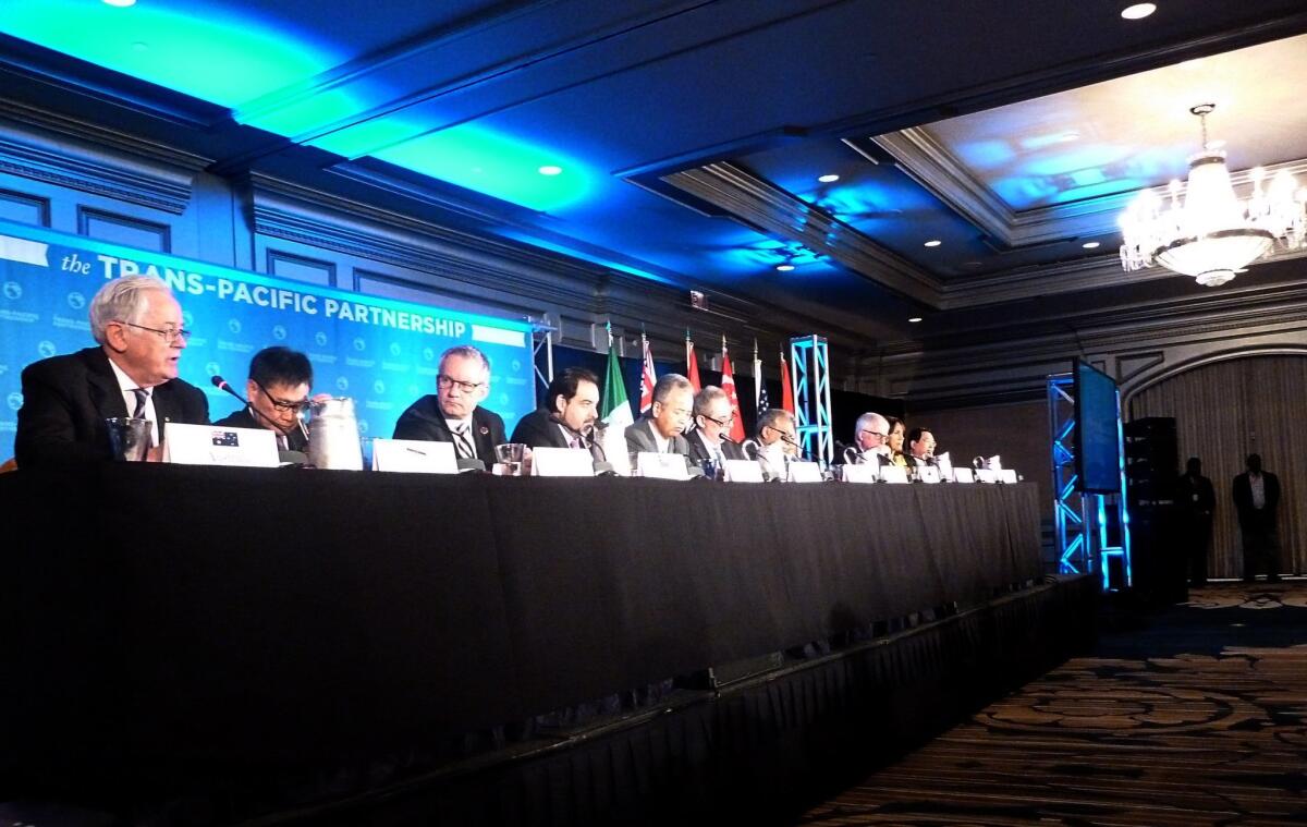 Delegates attending the Trans-Pacific Partnership talks hold a press conference Oct. 5 in Atlanta. Twelve Pacific rim countries sealed the deal then to create the world's largest free trade area.