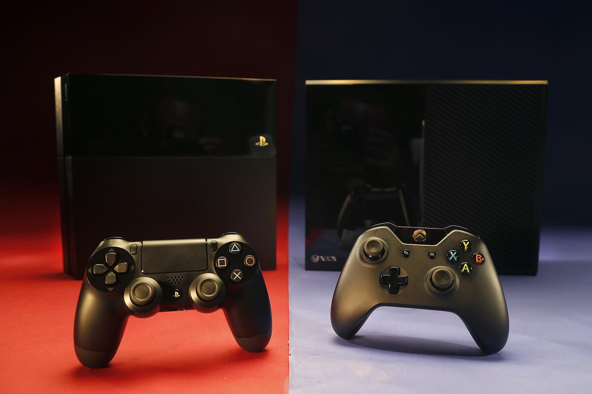 The newly introduced PlayStation 4 (left) and Xbox One spur a 50% spike in console game sales in December, compared with a year ago, according to NPD.
