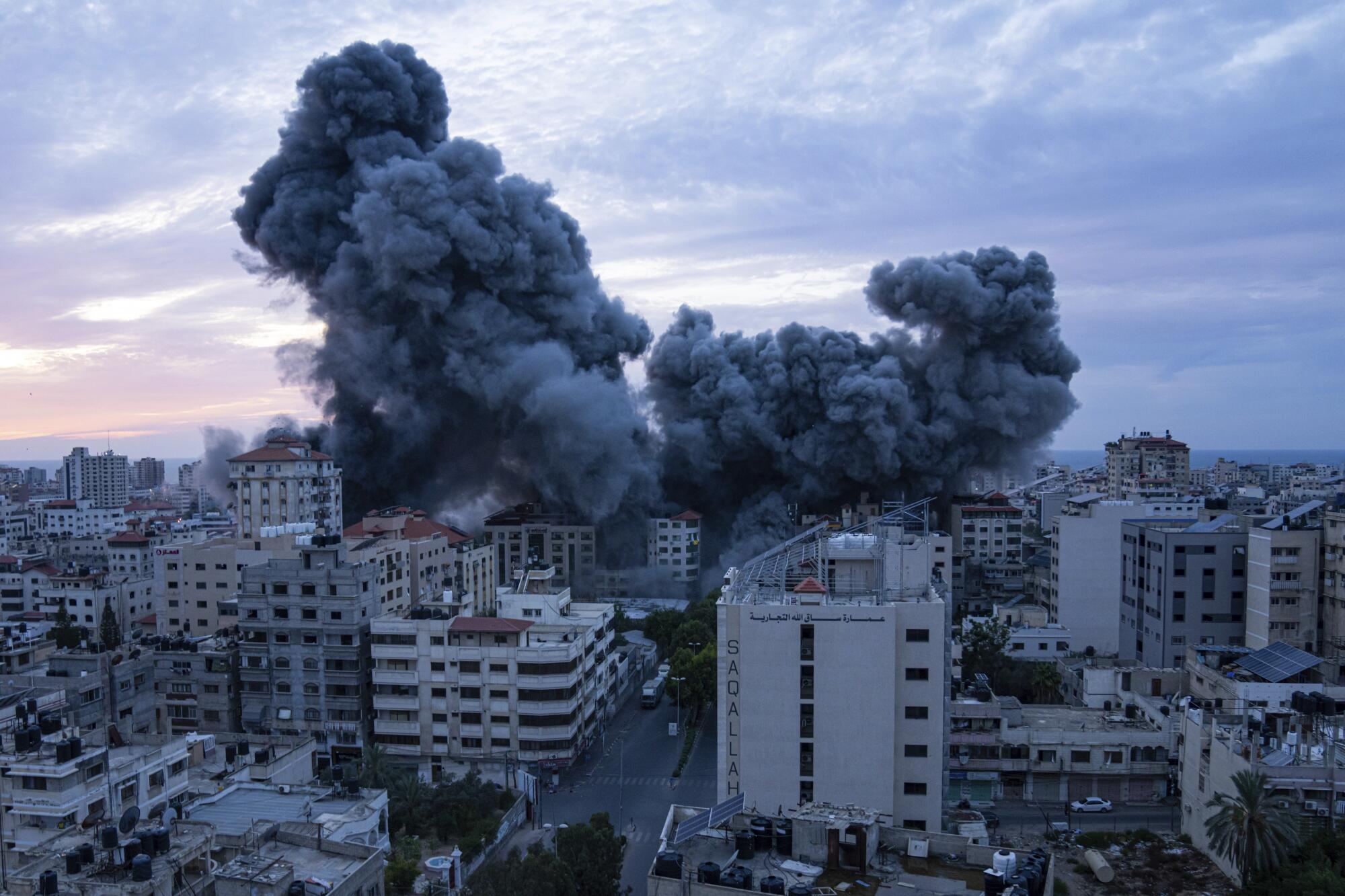 The bombing of Palestine Tower in Gaza, a 14 story residential building, on October 7, 2023. Photo: Fatima Shbair/Associated Press.