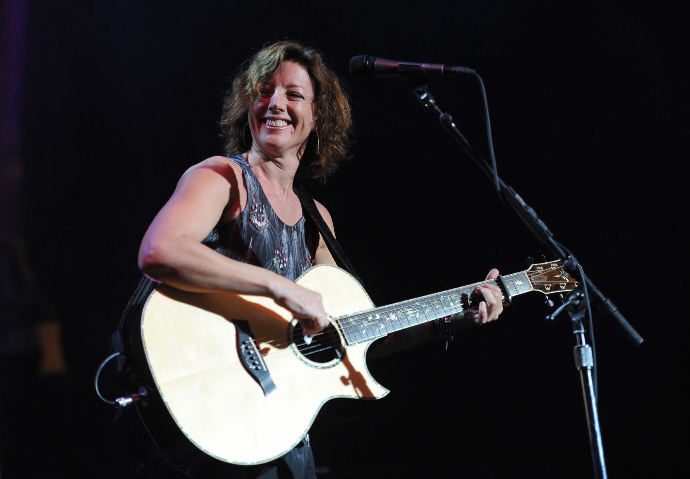 Sarah McLachlan gets in tune with her guitar at the ELLE fifth annual Women in Music concert celebration.