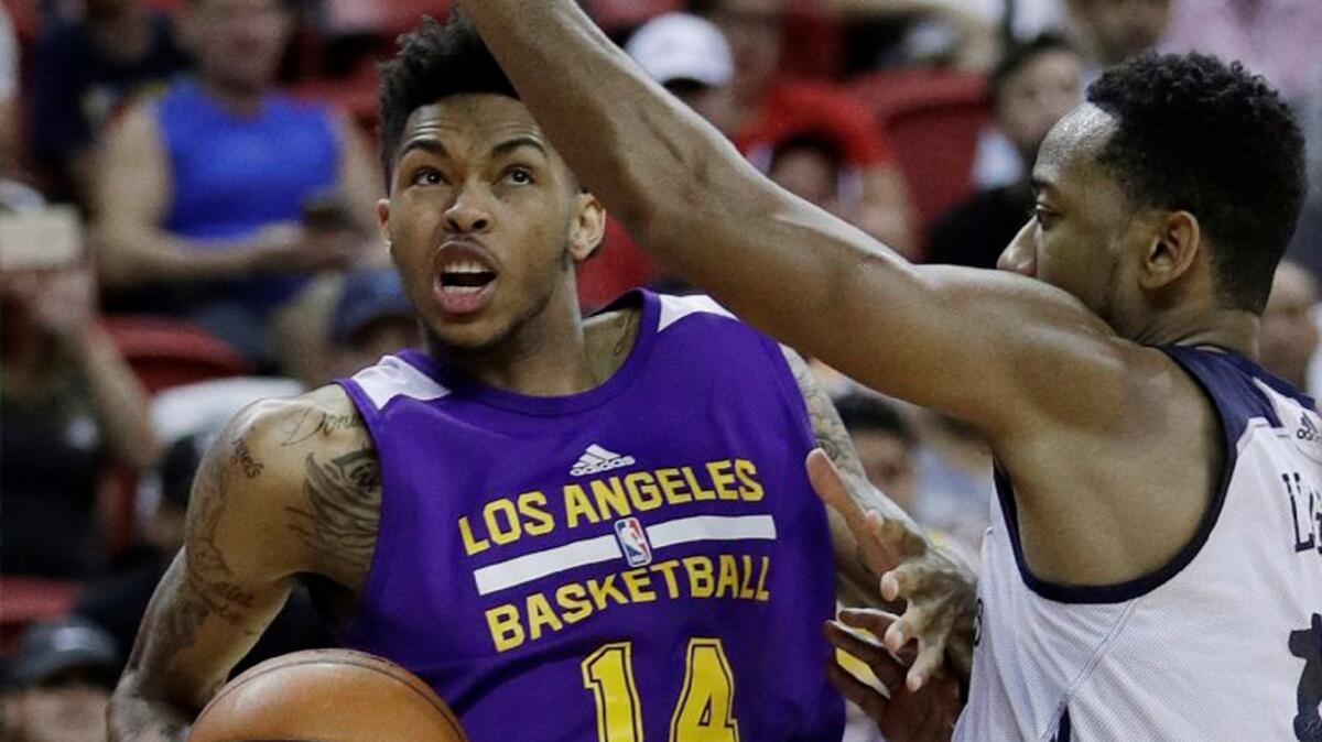 Lakers rookie Brandon Ingram drives around New Orleans' David Lighty Jr. during the second half of an NBA summer league game in Las Vegas.