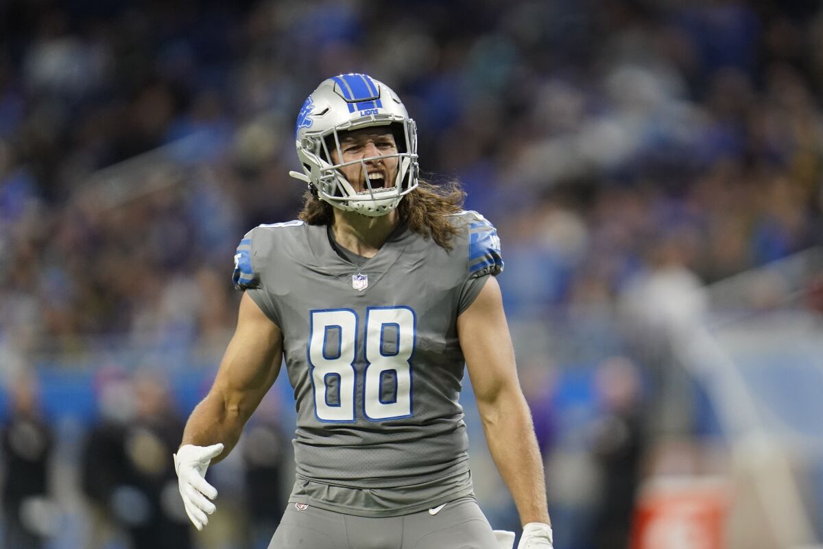 Detroit Lions tight end T.J. Hockenson reacts after his touchdown during the first half of an NFL football game against the Minnesota Vikings, Sunday, Dec. 5, 2021, in Detroit. (AP Photo/Paul Sancya)