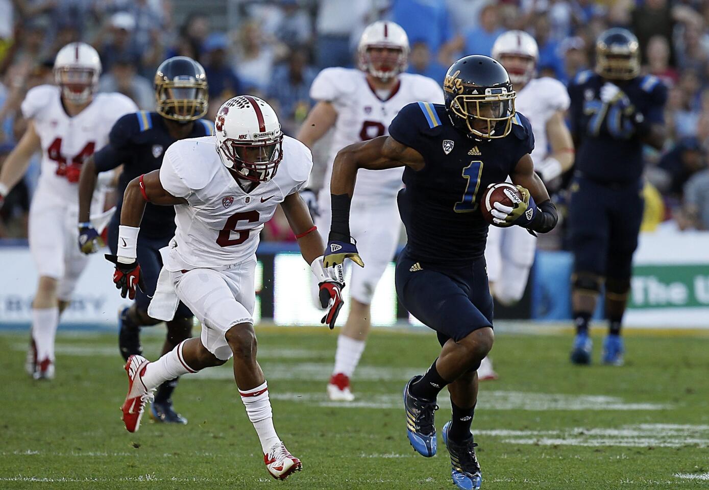 UCLA receiver Shaquelle Evans breaks away from the Stanford secondary at the beginning of a 71-yard pass play in the first quarter Saturday at the Rose Bowl.