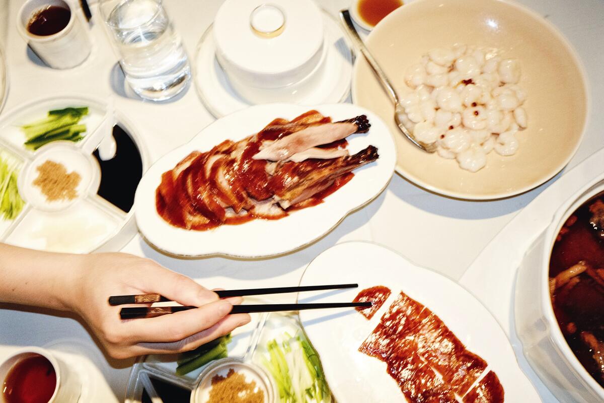 An array of dishes, including Peking duck and cold Shanghai-style river shrimp at Array 36.