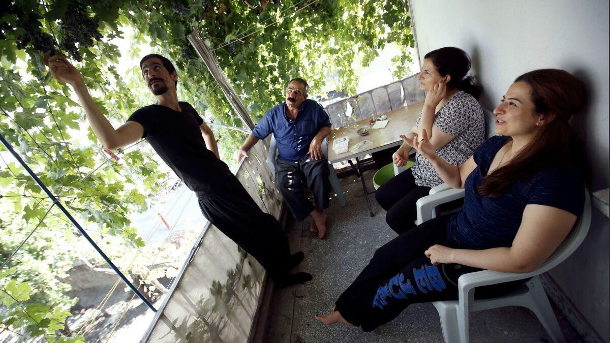 The Moradis on the porch of their friends' home in Turkey.