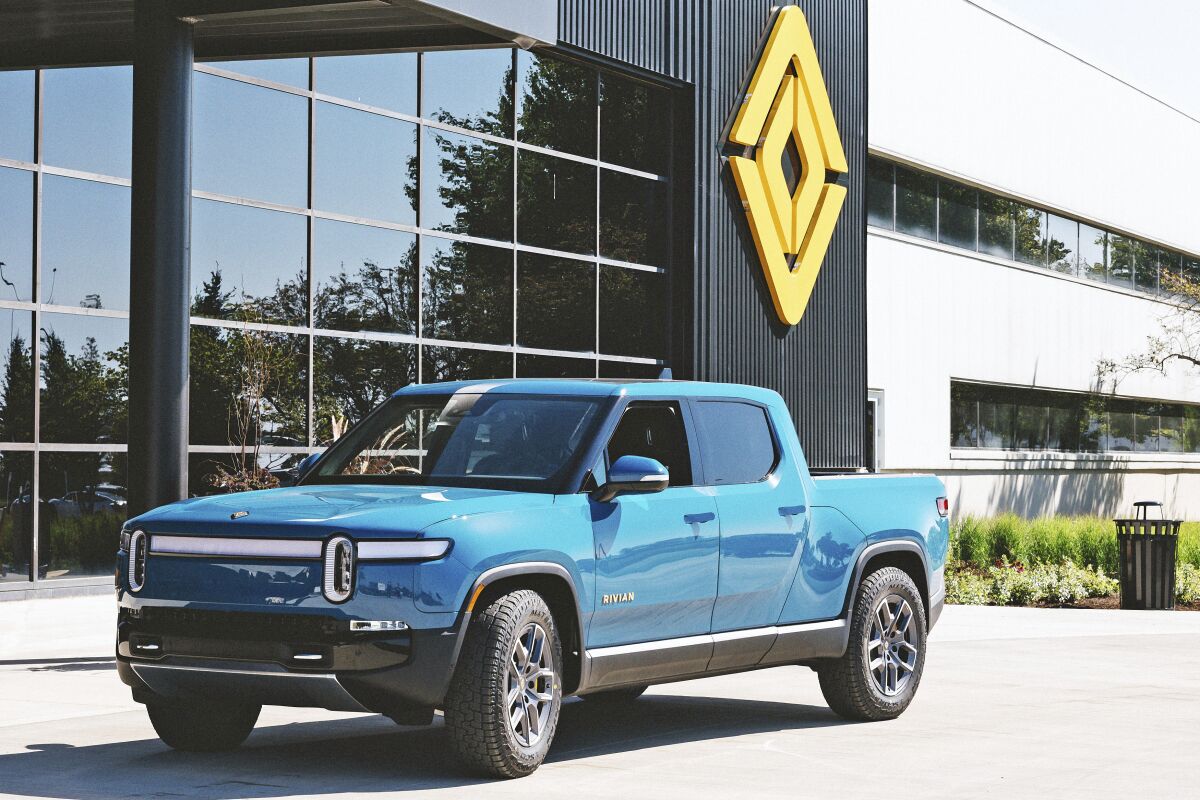 This photo, provided by Rivian, shows the 2022 Rivian R1T. It is an all-electric pickup truck with an estimated annual electricity cost of $950. (Rivian Automotive via AP)