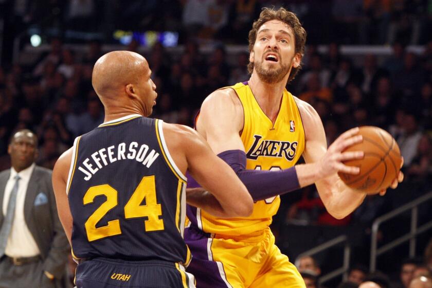 Lakers power forward Pau Gasol looks to score against Jazz forward Richard Jefferson in the first half Friday night at Staples Center.