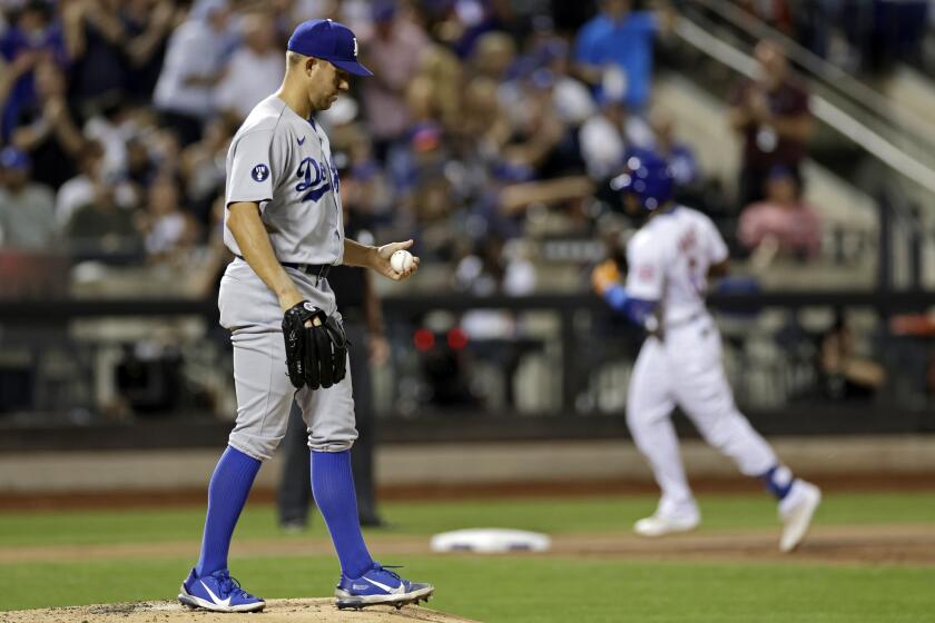 Los Angeles Dodgers pitcher Tyler Anderson reacts after giving up a two-run home run to New York Mets' Starling Marte during the third inning of a baseball game Wednesday, Aug. 31, 2022, in New York. (AP Photo/Adam Hunger)