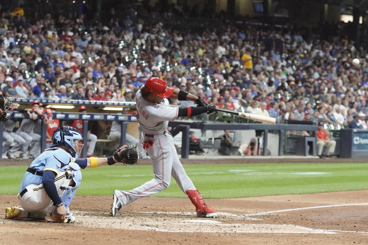 Cincinnati Reds' Jose Barrero hits a home run during the sixth inning of a baseball game against the Milwaukee Brewers Saturday, Aug. 6, 2022, in Milwaukee. (AP Photo/Morry Gash)