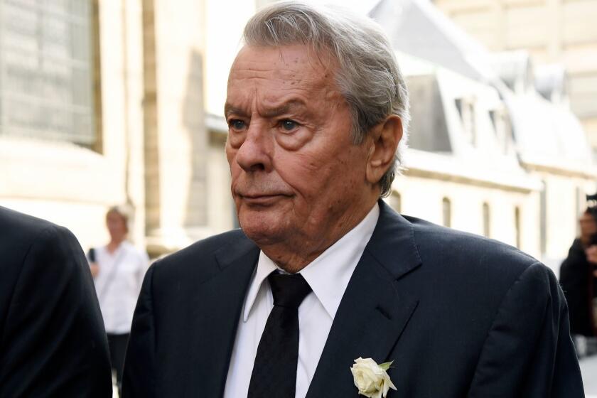 (FILES) In this file photo taken on September 1, 2017 French actor Alain Delon leaves the Saint-Sulpice church following a funeral mass for late actress Mireille Darc in Paris. - Alain Delon will receive a Golden Palm of Honor during the 72nd Cannes film festival said on April 17 the organizers, on the eve of the presentation of the list of the movies competing in this year's festival. (Photo by Bertrand GUAY / AFP)BERTRAND GUAY/AFP/Getty Images ** OUTS - ELSENT, FPG, CM - OUTS * NM, PH, VA if sourced by CT, LA or MoD **