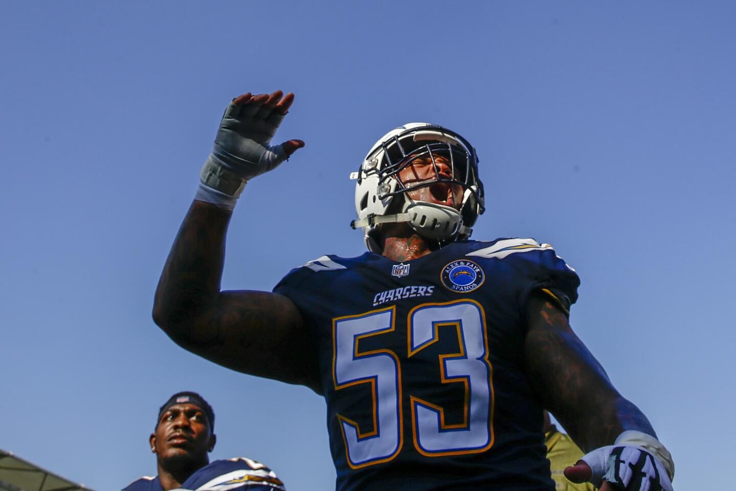 Chargers center Mike Pouncey yells out on his way to the locker room before a game against the Denver Broncos at Stubhub Center on Sunday.