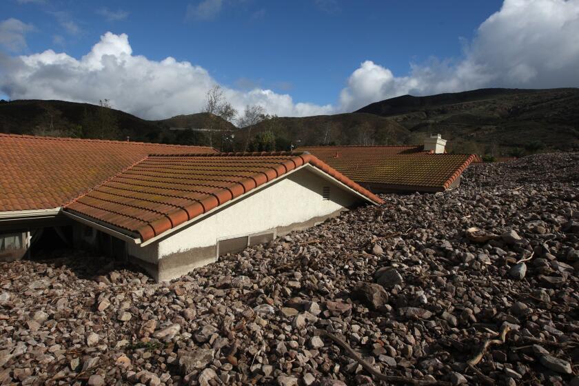 A powerful storm swept rocks and mud debris into a neighborhood in Camarillo Springs on Dec. 12, 2014, leaving 10 houses uninhabitable.