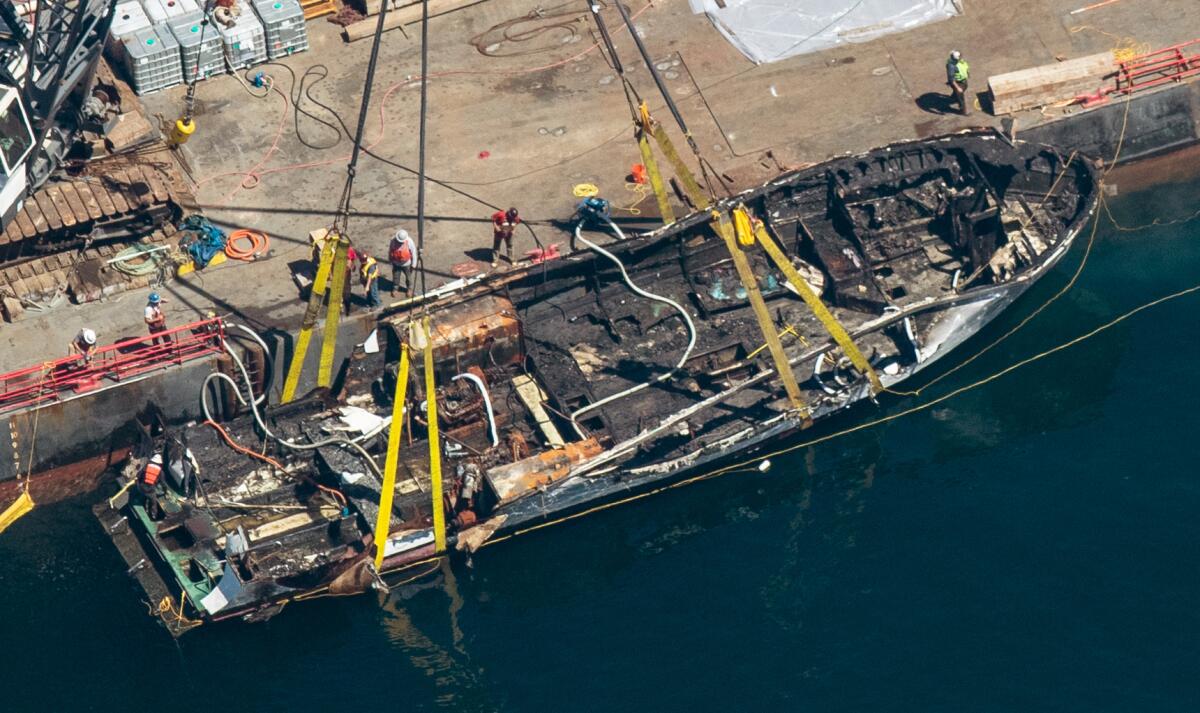 The burned hulk of the Conception is brought to the surface by a salvage team off Santa Cruz Island on Sept. 12.