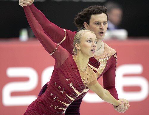 Russian gold medalists Tatiana Totmianina and Maxim Marinin, right, perform during the Pairs Skating final in Turin.