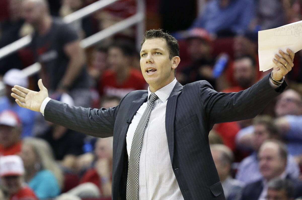 Luke Walton, serving as Golden State's interim coach earlier this season, questions a call during a game against the Rockets in Houston.