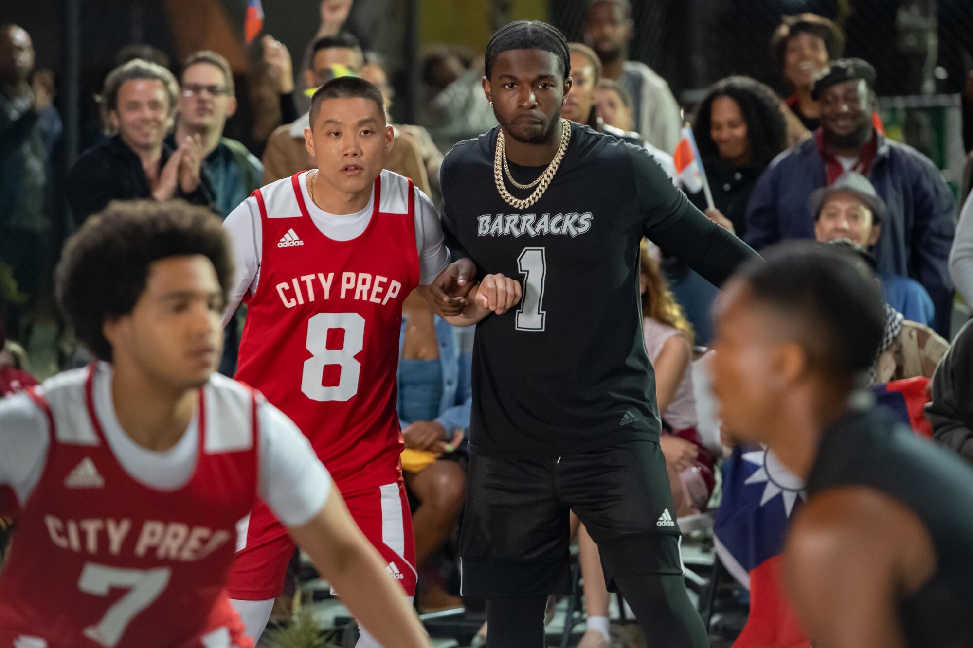 Taylor Takahashi and Bashar "Pop Smoke" Jackson on a basketball court.