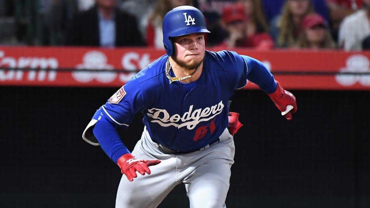Dodgers outfielder Alex Verdugo hits a double during an exhibition game against the Angels on March 25.