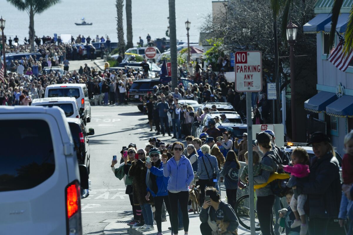 People watch as President Biden arrives in Capitola,Calif.