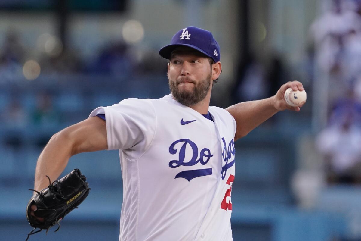 Dodgers starting pitcher Clayton Kershaw delivers against the Cleveland Guardians.