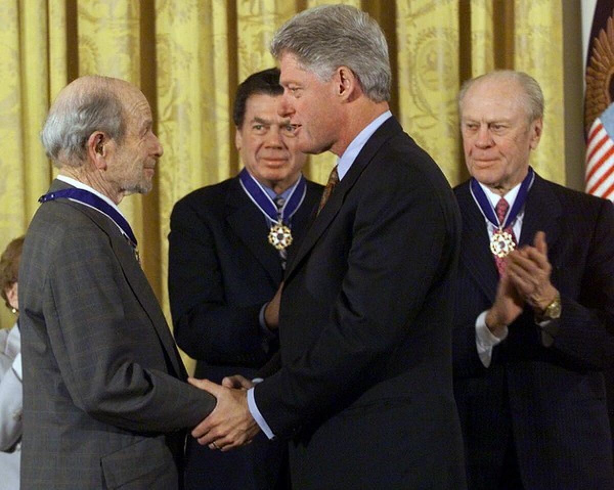 Wayburn accepts the Presidential Medal of Freedom from Bill Clinton in 1999. Other recipients were Edgar Bronfman, center, World Jewish Congress president, and former President Gerald Ford.