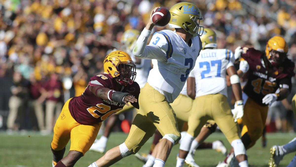 UCLA's Wilton Speight tries to pass under pressure by Arizona State linebacker Khaylan Kearse-Thomas in the second half.