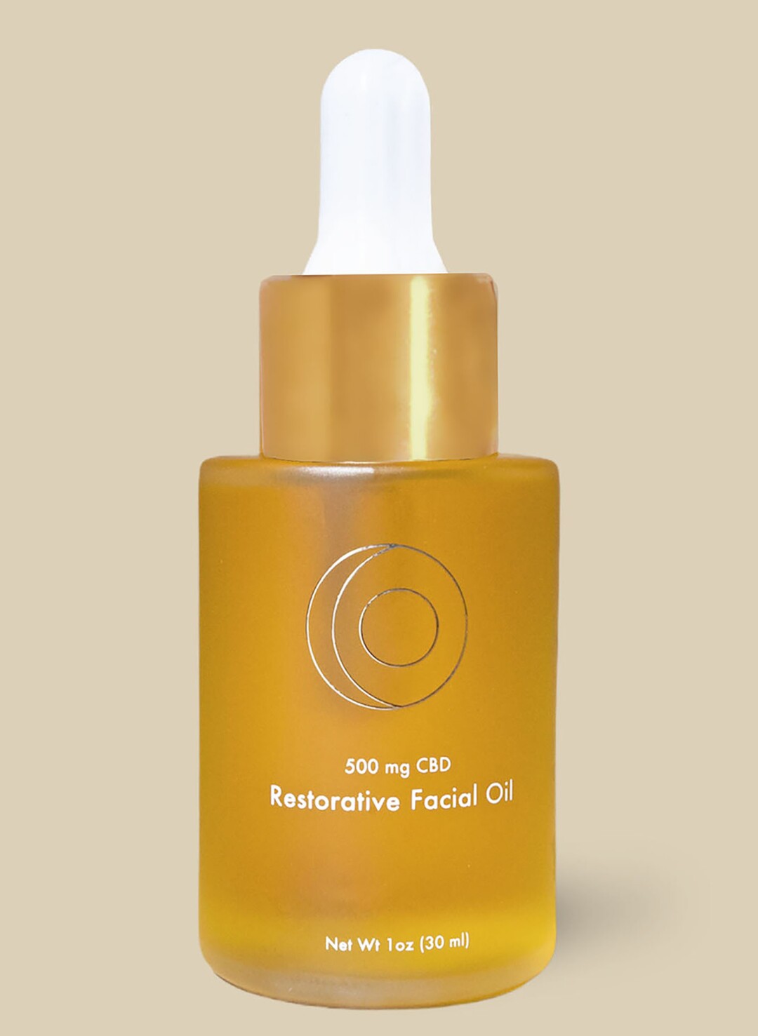 A bottle of Half Hippy Drippin' Gold Restorative Face Oil