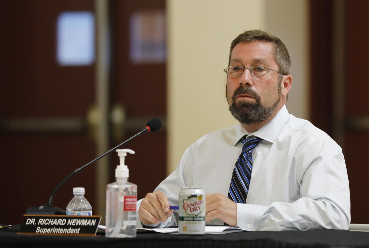 Alpine schools Supt. Rich Newman speaks at a school board meeting.