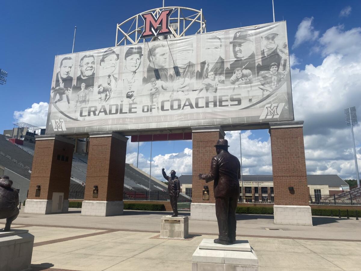 Miami (Ohio) University displays statues of its famous alumni coaches outside its football stadium.