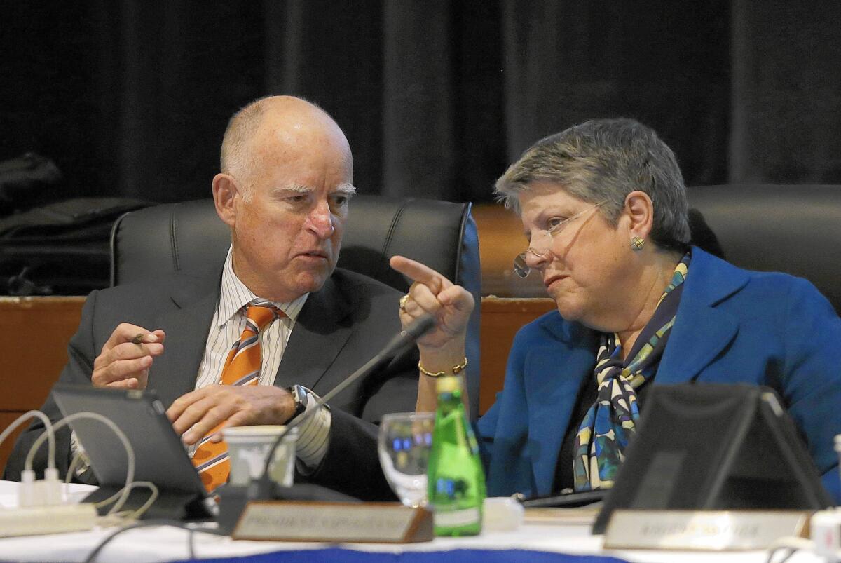 University of California President Janet Napolitano speaks with Gov. Jerry Brown during a UC Board of Regents meeting Wednesday.