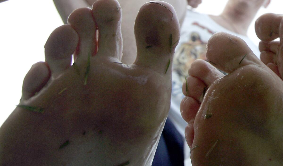 Bare feet are just one of the crimes people get called out for in Passenger Shaming, but these belong to runners in the Palos Verdes Marathon in San Pedro on May 14, 2005.