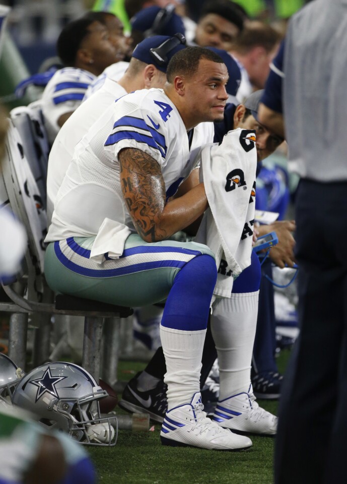 Dallas Cowboys' Dak Prescott on the bench during the second half of an NFL divisional playoff football game against the Green Bay Packers Sunday, Jan. 15, 2017, in Arlington, Texas. (AP Photo/Michael Ainsworth)