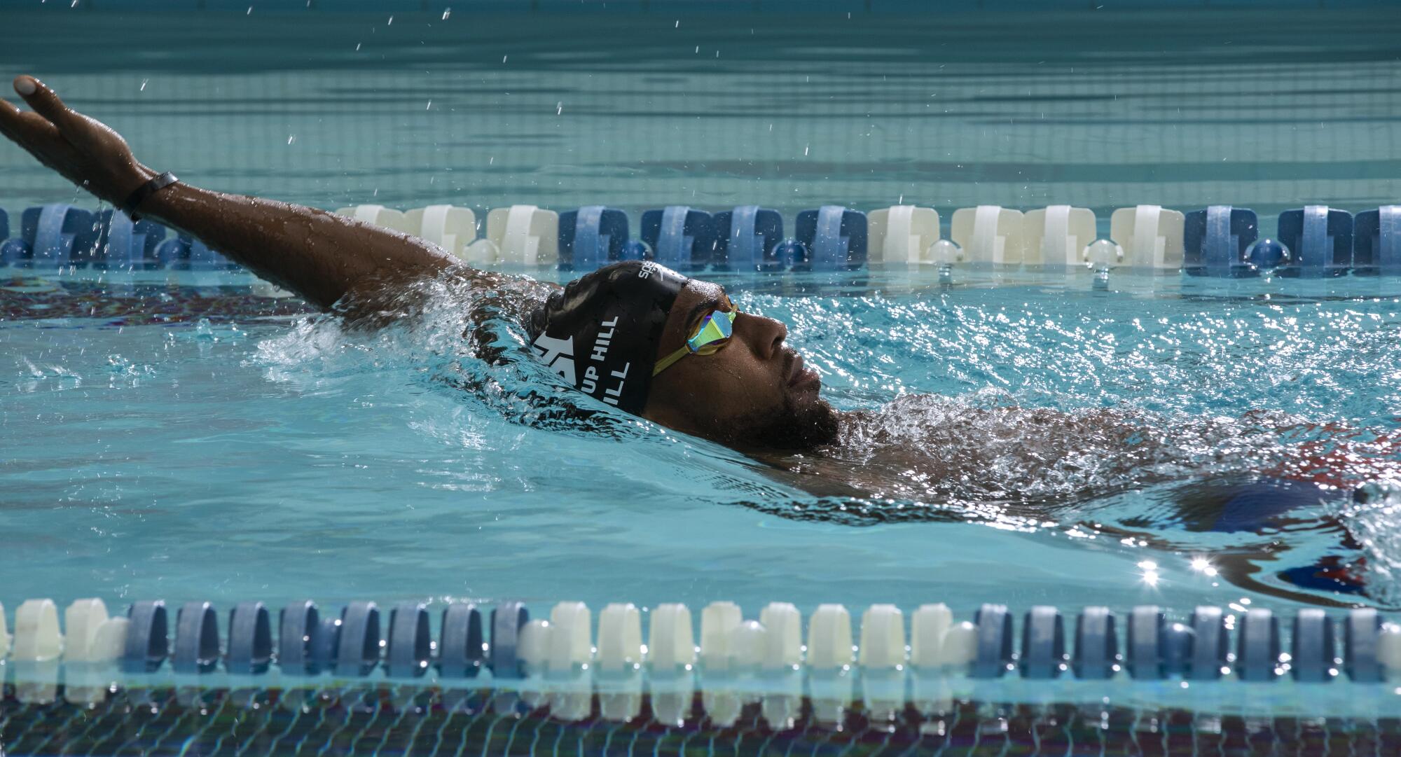 Jamal Hill swims the back stroke